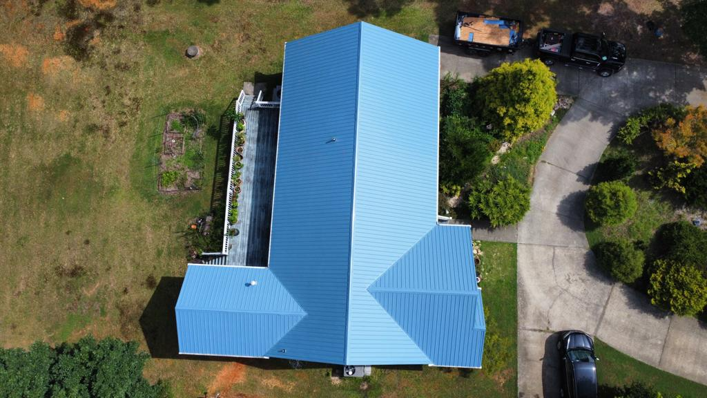 Overhead View of a Home with Blue Metal Roofing